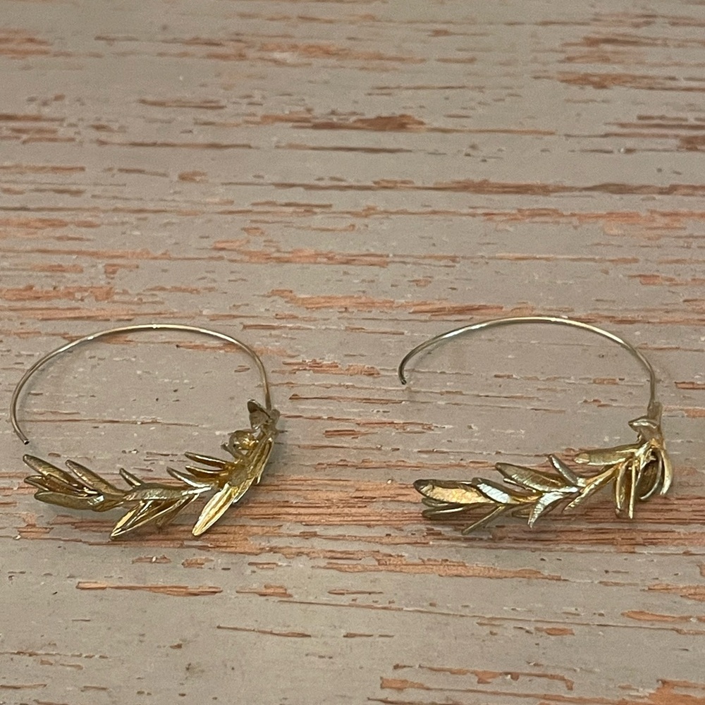 Delicate gold tone leaf or olive branch hoop earrings